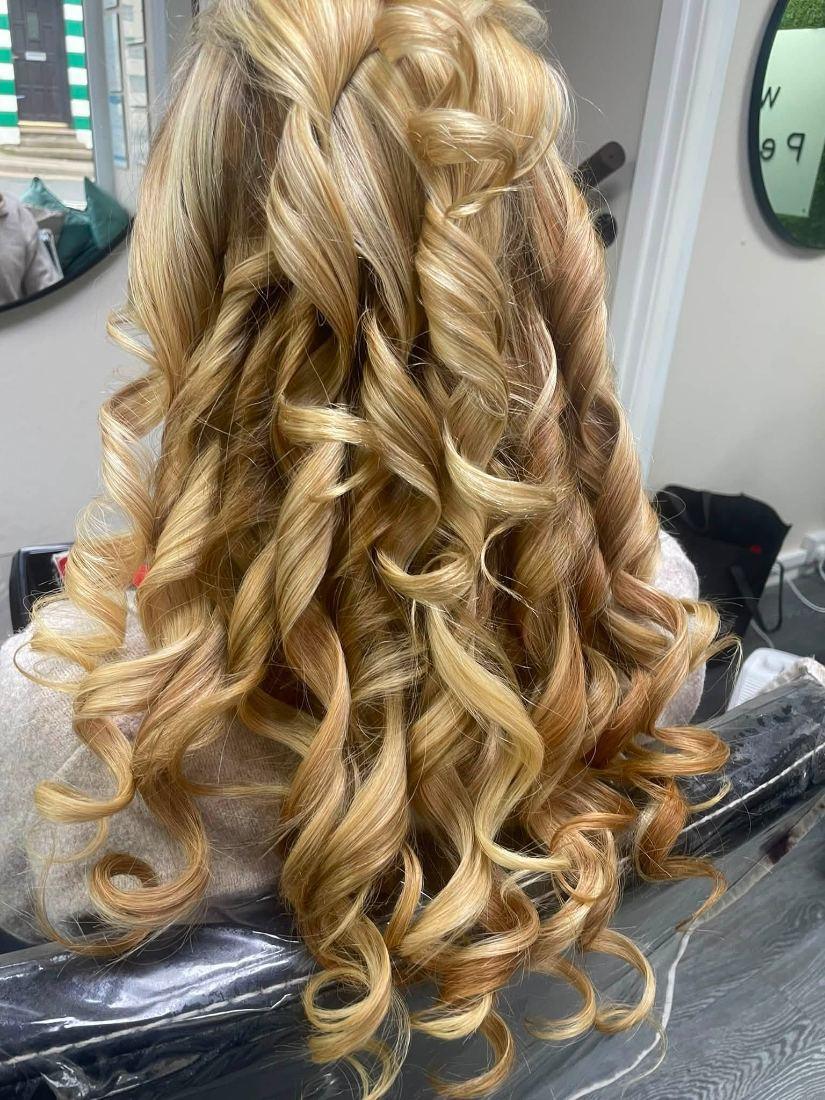 Long blonde hair set in curls