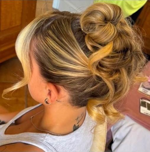 A soft curled occasion up-do