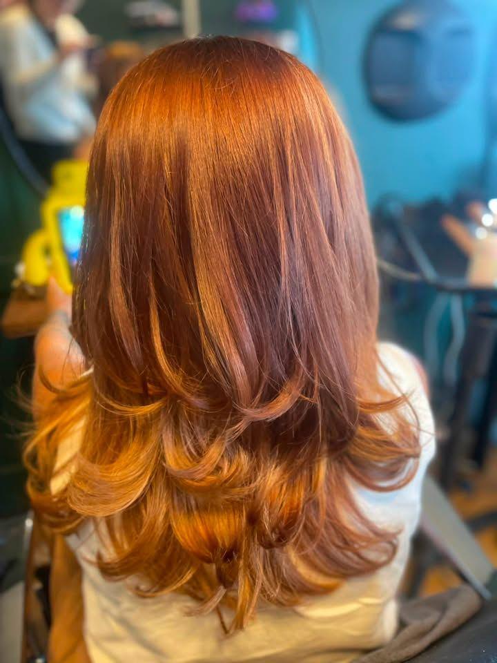 A copper blow dry with soft, layered movement