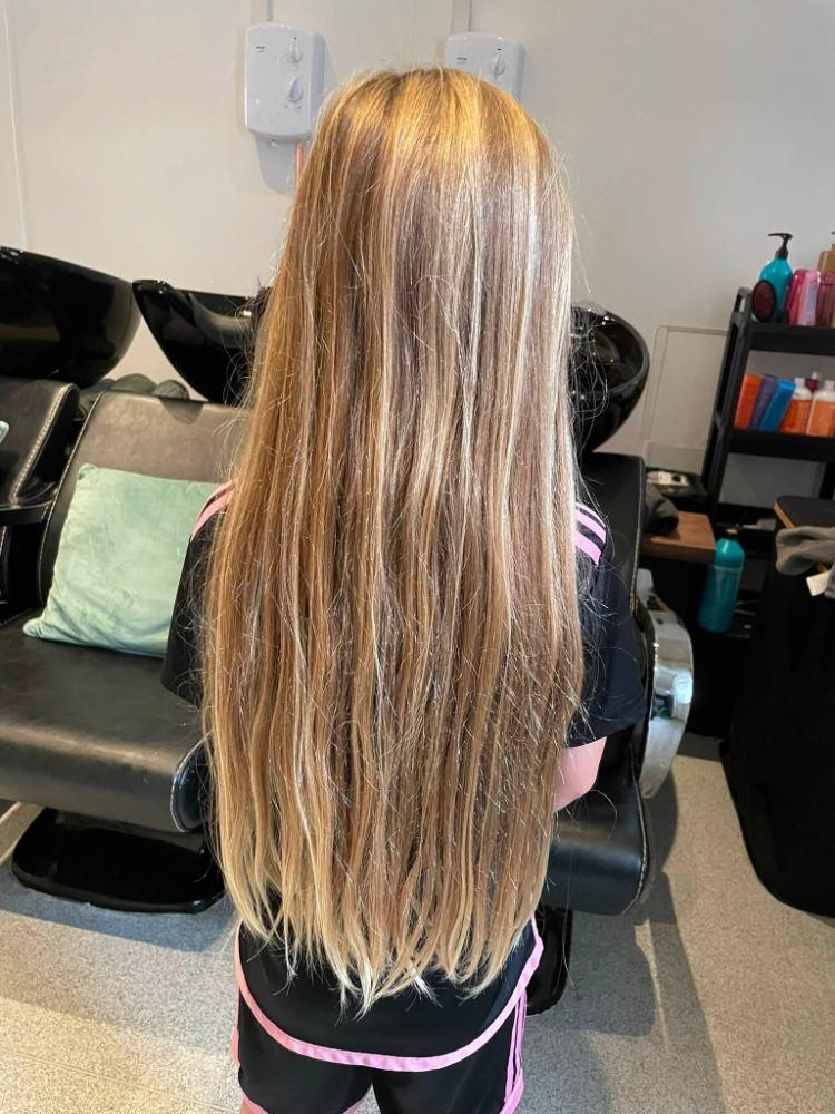 Long hair with fine highlights in the salon