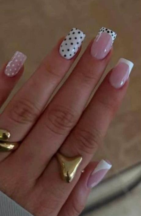 Pink nails with polka dot accent